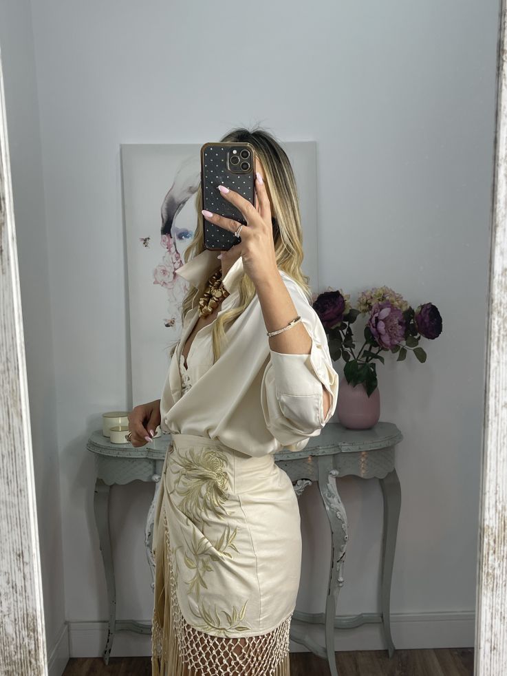 Falda pantalón beige bordados con flecos
