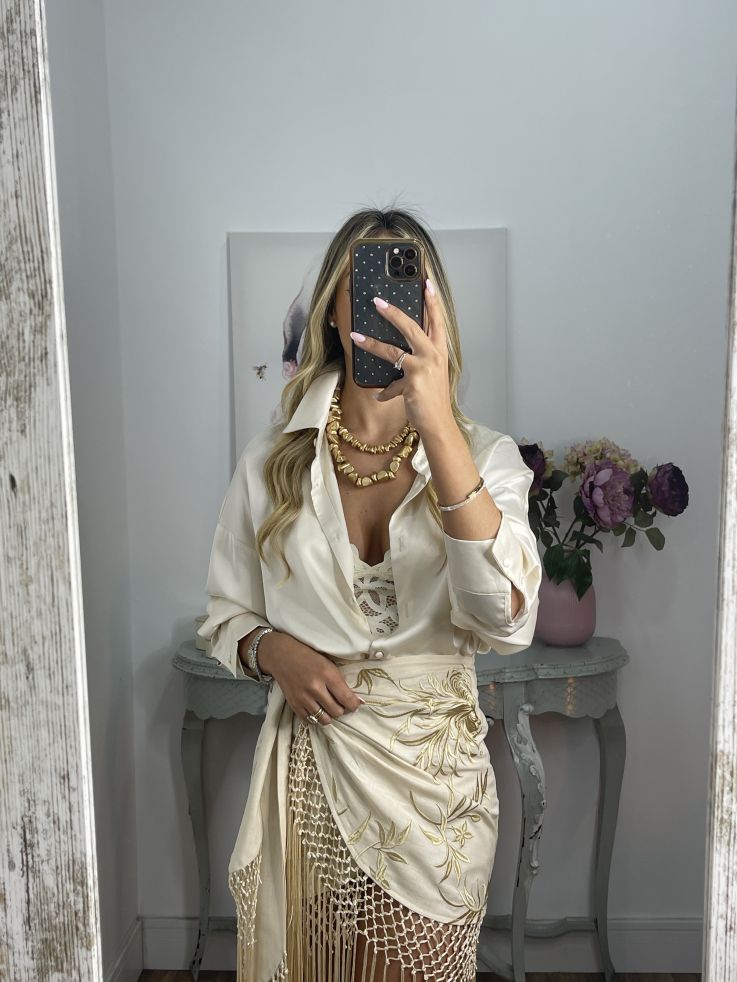 Falda pantalón beige bordados con flecos