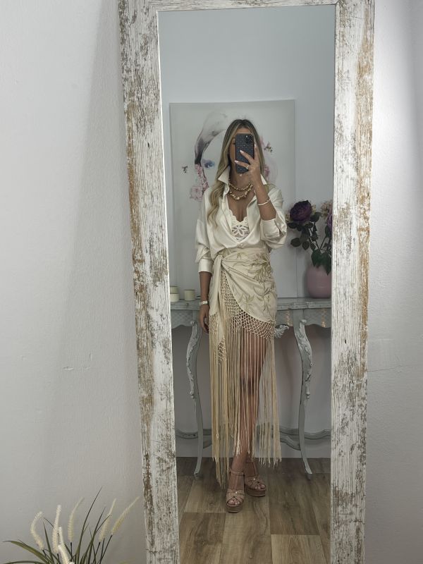 Falda pantalón beige bordados con flecos