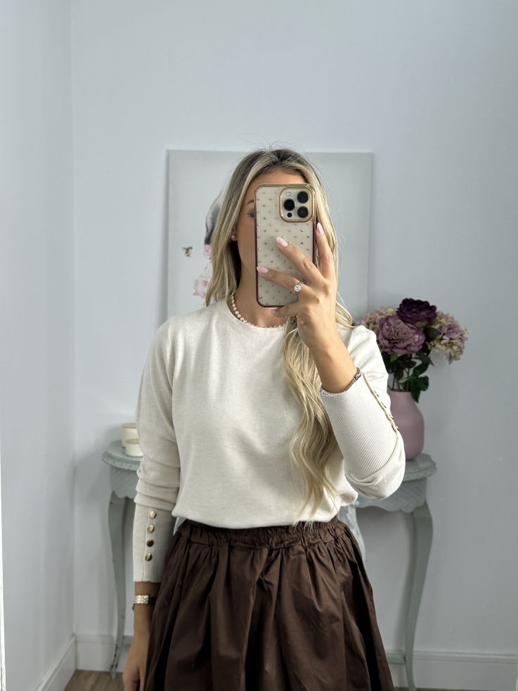 Jersey beige basic con botones dorados en el puño