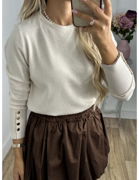 Jersey beige basic con botones dorados en el puño