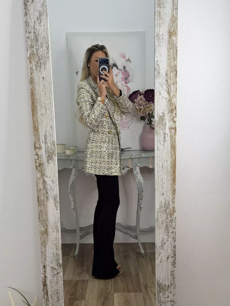 Chaqueta con lentejuelas doradas y negra