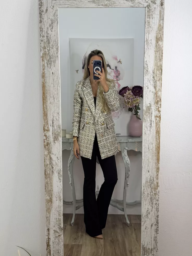 Chaqueta con lentejuelas doradas y negra