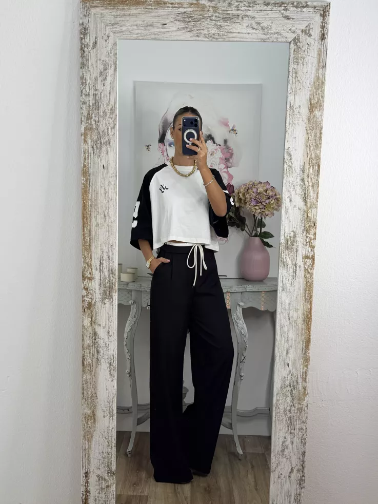 Pantalón negro con cinturilla blanca