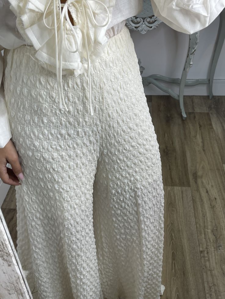 Pantalón tejido punto rugoso hueso