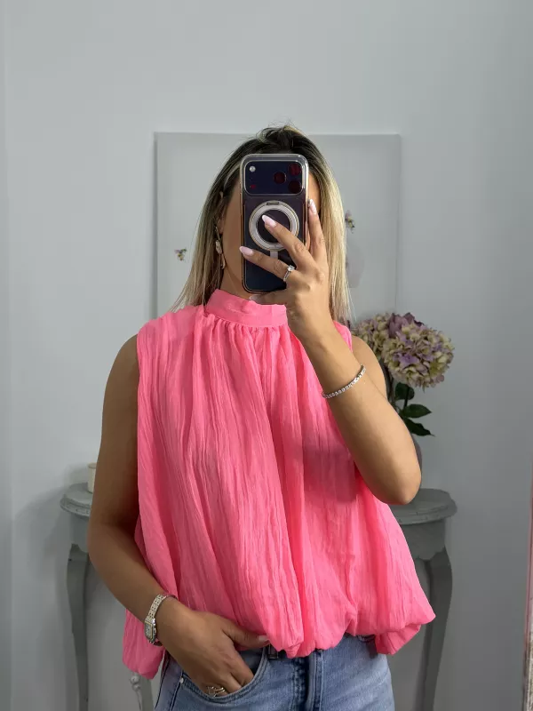 Blusa rosa fluorescente lazada espalda al aire