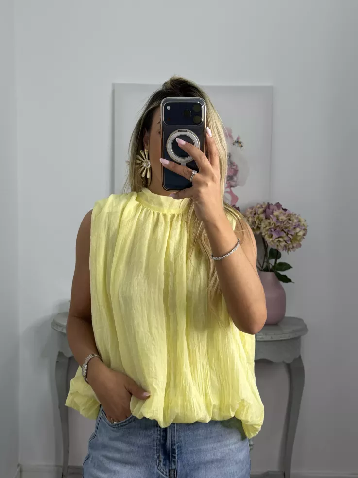 Blusa amarilla fluorescente lazada espalda al aire