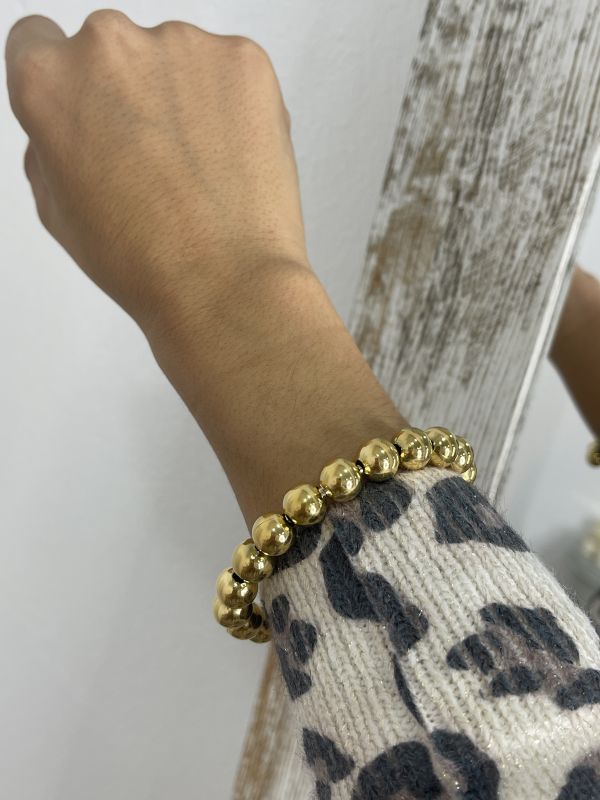 Pulsera bola dorada