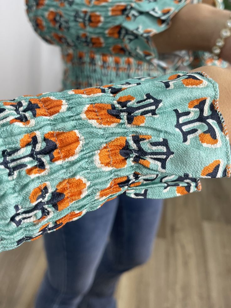 Top nido abeja verde agua y naranja estampado