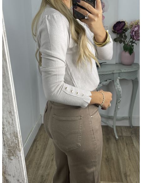 Jersey basic beige con botones en el puño